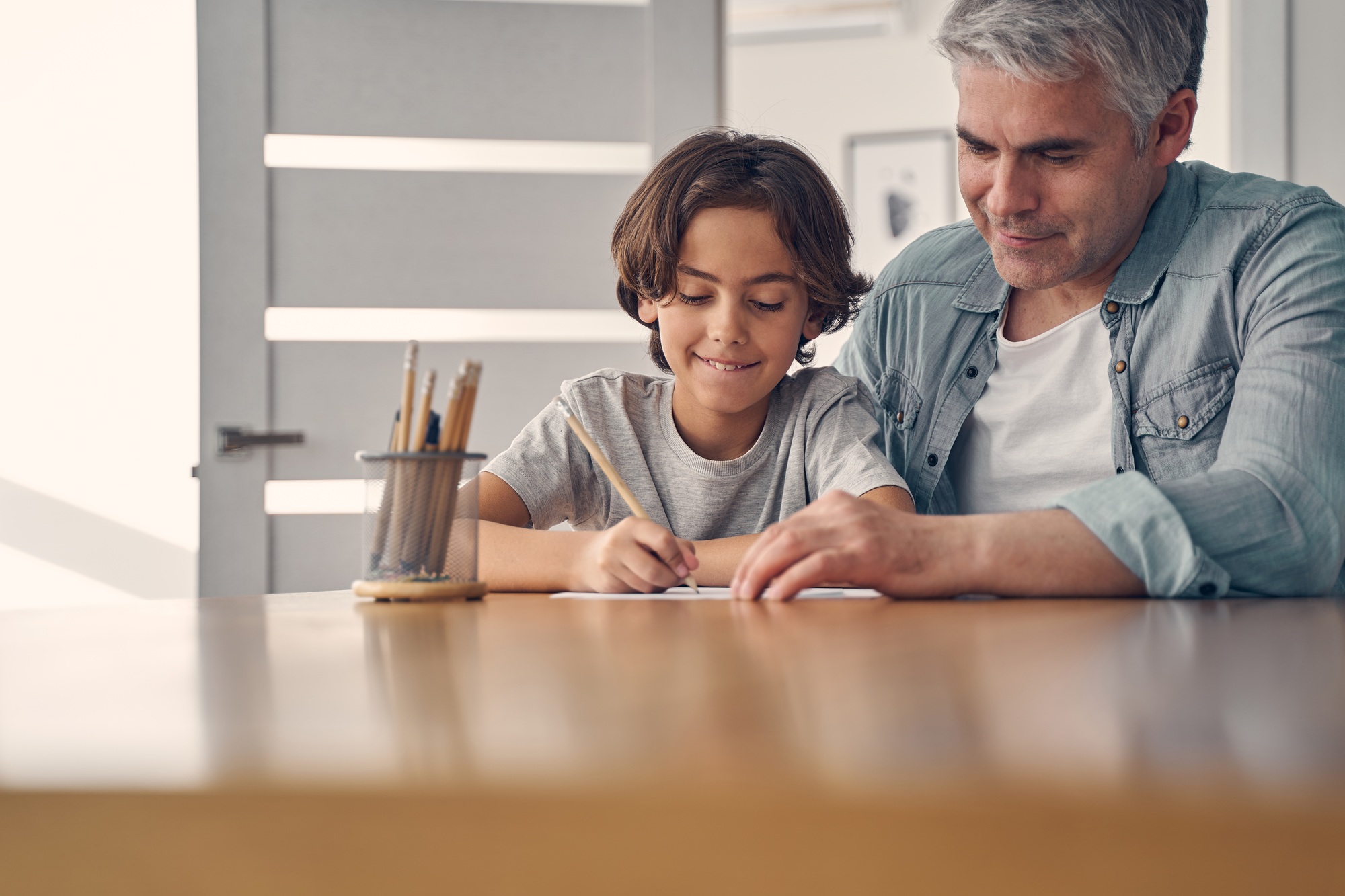 Happy parent and kid spending time at home
