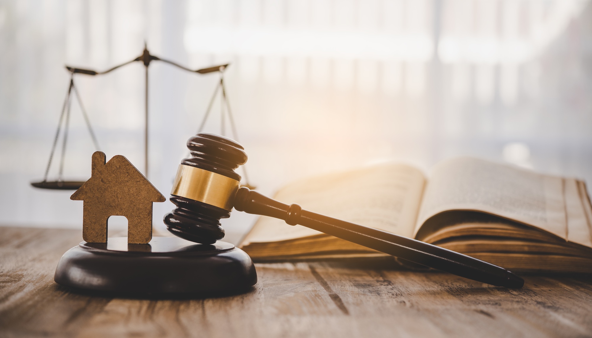 Model of house and gavel.House auction real estate law concept.